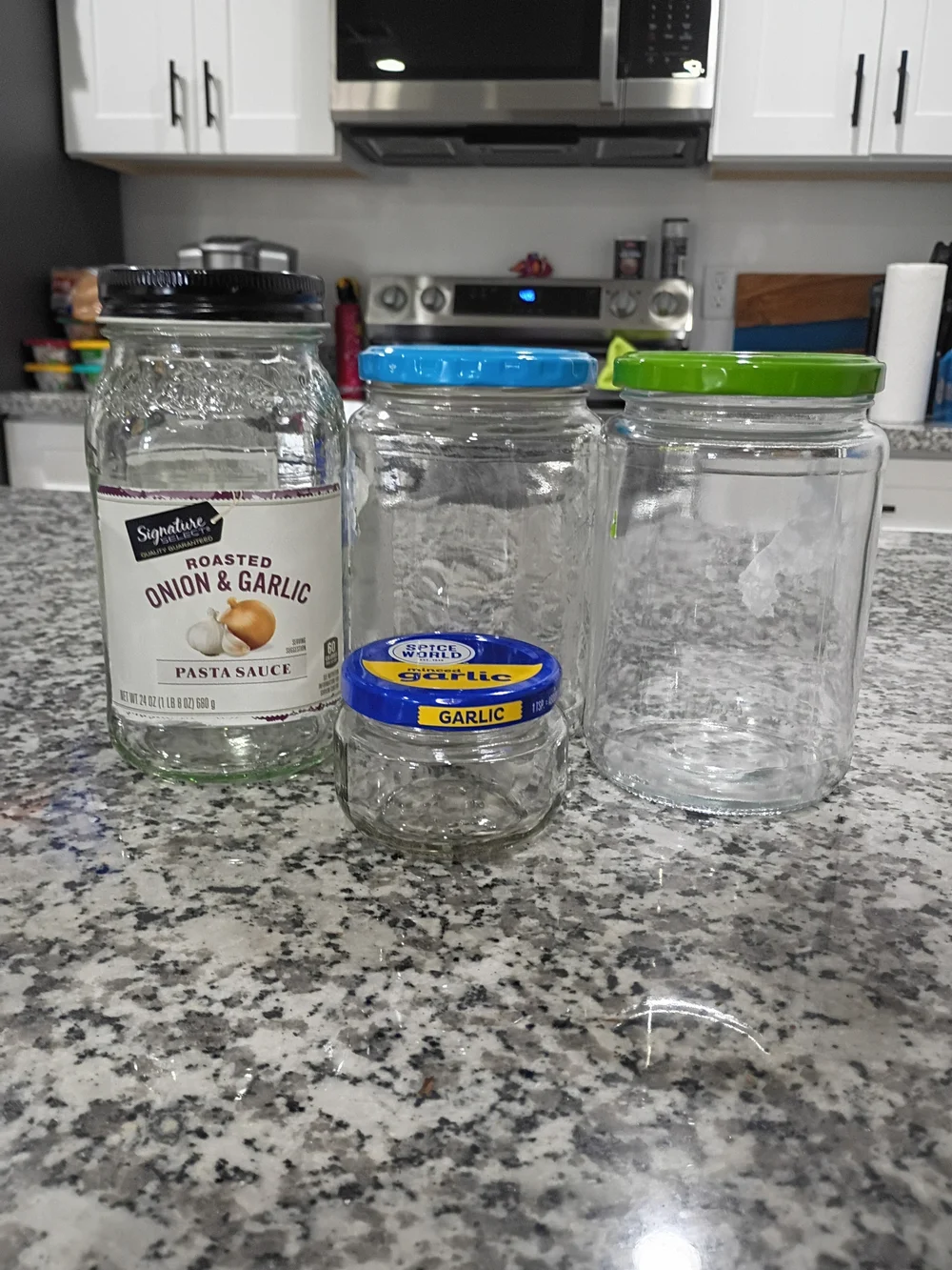 Assorted Glass And Aluminum Storage Jars with Colorful Lids